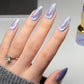 DND DC Gel Polish Cat Eye in Celestial Prism shade, showcasing iridescent purple and blue gel with a cat eye effect.