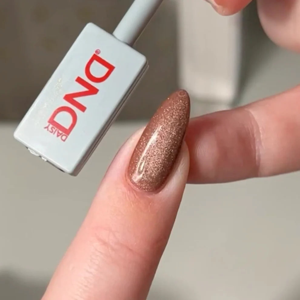 DND DC Gel Polish Cocoa Whiskers #27 with brown velvet cream finish and subtle cat eye shimmer on nails.