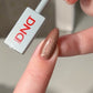 DND DC Gel Polish Cocoa Whiskers #27 with brown velvet cream finish and subtle cat eye shimmer on nails.