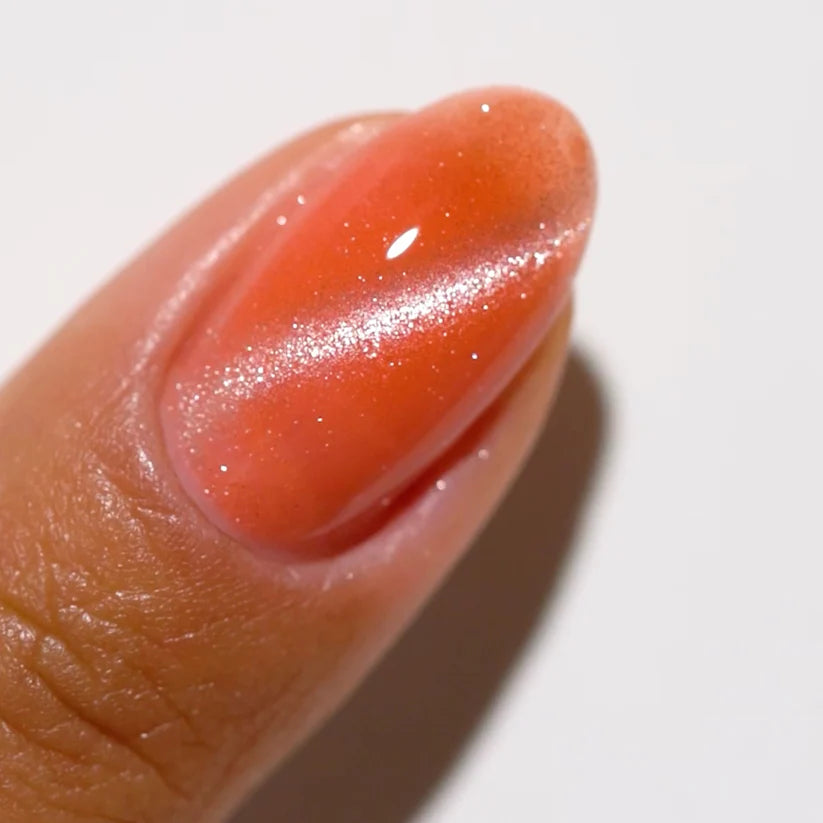 DND DC Gel Cat Eye polish in Coral Ice shade, vibrant coral gel nail color with cat eye effect, DND brand, image 9d-12.webp