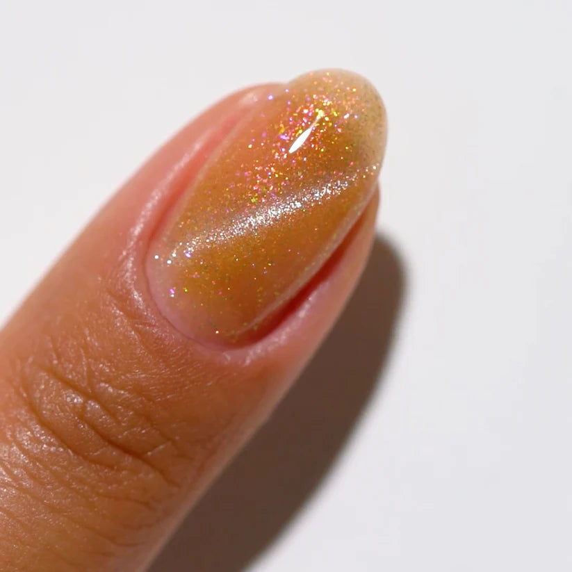 DND DC Gel Polish in Cosmic Astral #13 showing a vibrant, shimmering cat eye gel nail finish with cosmic blue and silver hues