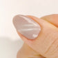 DND DC Gel Polish Fossil Ice #31 swatch showing purple-gray cat eye shimmer with velvet finish on nails.