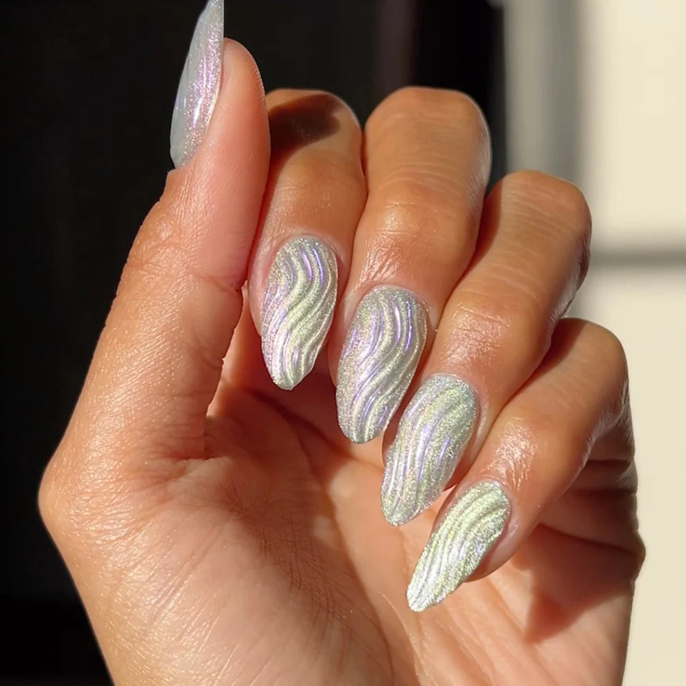 DND DC Gel Polish in Holo Dancer #21 with neon chrome finish, showcasing a vibrant cat eye holographic nail art design.