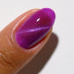 DND DC Gel Polish Cat Eye Jelly Drippin' shade #05 showcasing vibrant, glossy purple gel nail color with cat eye effect.