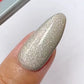 DND DC Gel Polish in Korat Stardust #30 with neutral velvet cat eye shimmer and cosmic nail design.