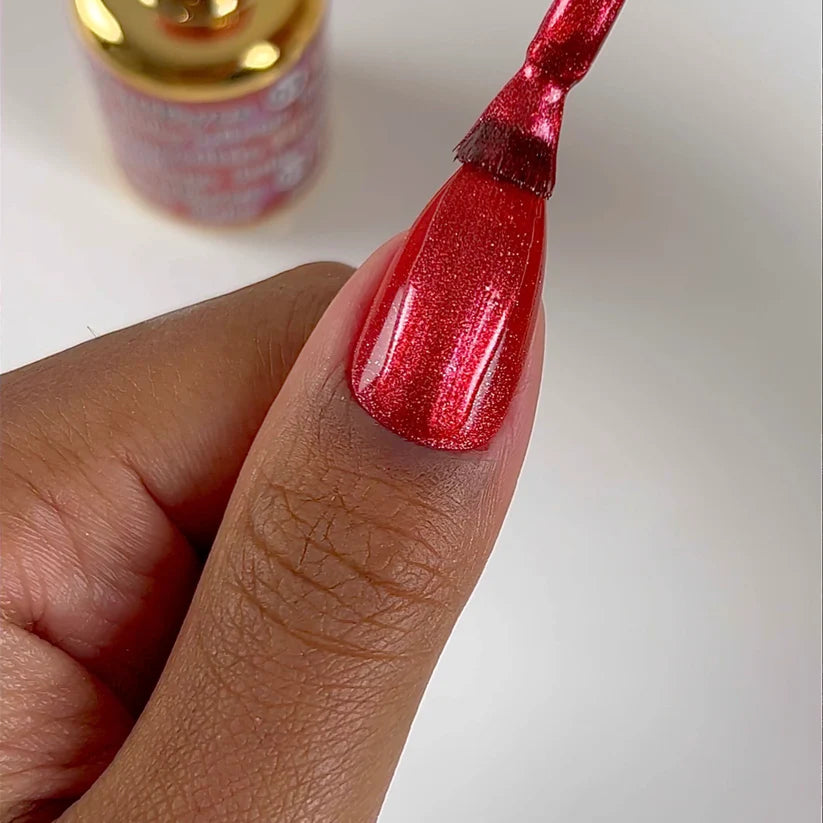 DND DC Gel Polish in Ruby Mirage #03, vibrant red gel cat eye nail polish with a shimmering mirror finish.