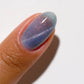DND DC Gel Polish Cat Eye in Seascape shade showing vibrant blue-green gel with shimmering cat eye effect on nails