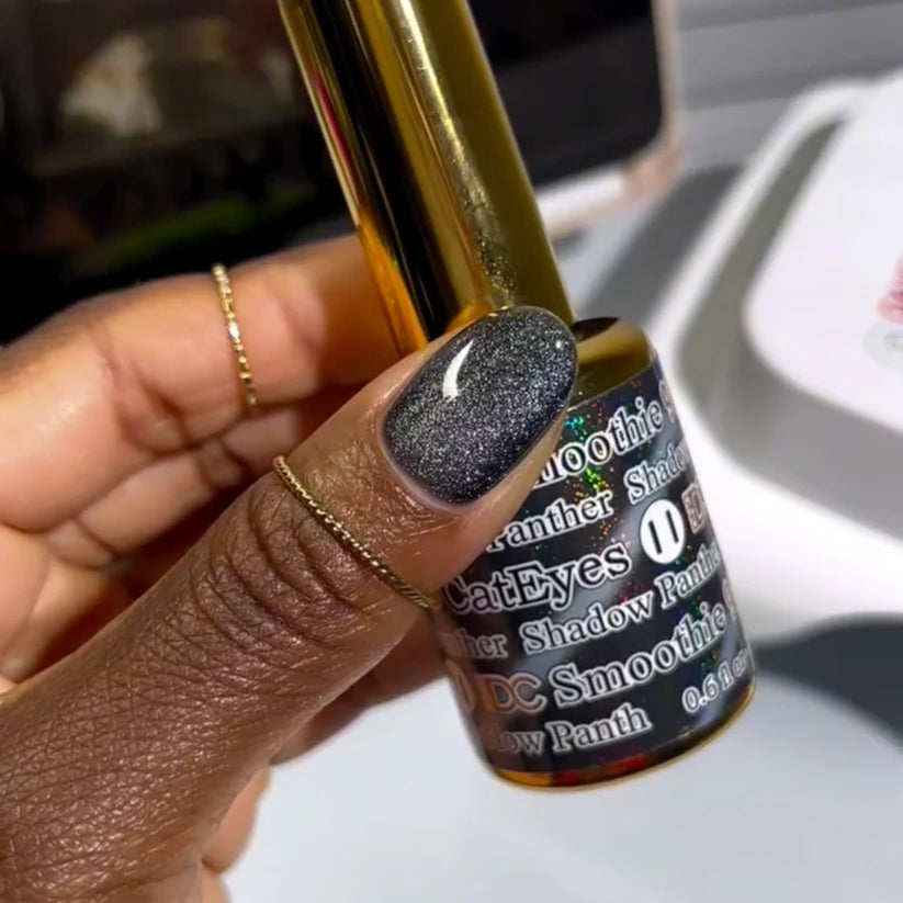 DND DC Gel Polish Cat Eye Shadow Panther #11 swatch showing deep black gel with blue and green shimmer accents.