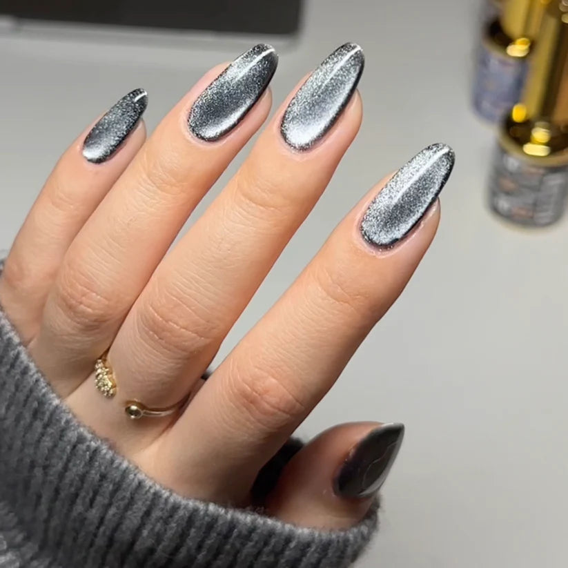 DND DC Gel Polish Cat Eye Shadow Panther #11 with a shiny, deep black and gray gel finish, showcasing the product's glossy texture.