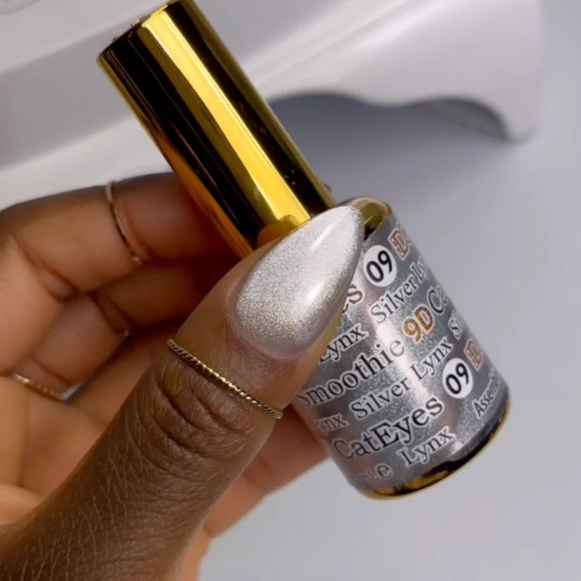 DND DC Gel Cat Eye polish in Silver Lynx #09, showcasing a smooth, shimmering silver cat eye gel on a nail swatch.