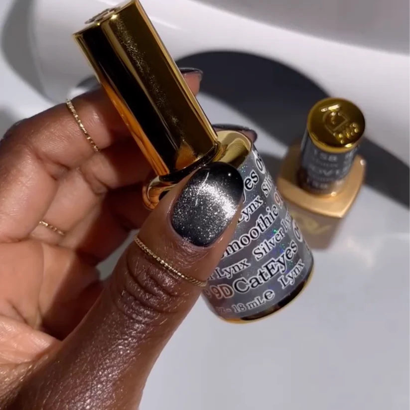 Silver Lynx DND DC Gel Cat Eye polish in shade #09, showcasing a sleek, reflective feline eye nail design with a metallic finish.