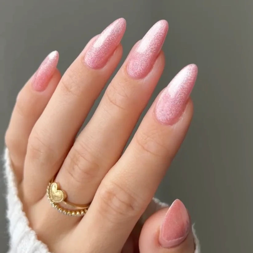DND DC Gel Polish in Sugar Floss #16, a vibrant pink cat eye gel with a shimmering, unicorn-inspired finish.