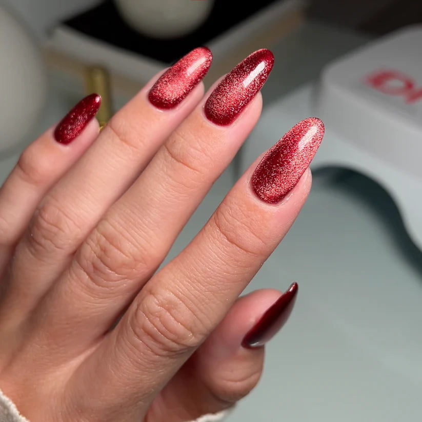 DND DC Gel Cat Eye polish in Wine N' Lust shade, smooth swatch showing deep burgundy with shimmering effect