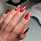 DND DC Gel Cat Eye polish in Wine N' Lust shade, smooth swatch showing deep burgundy with shimmering effect