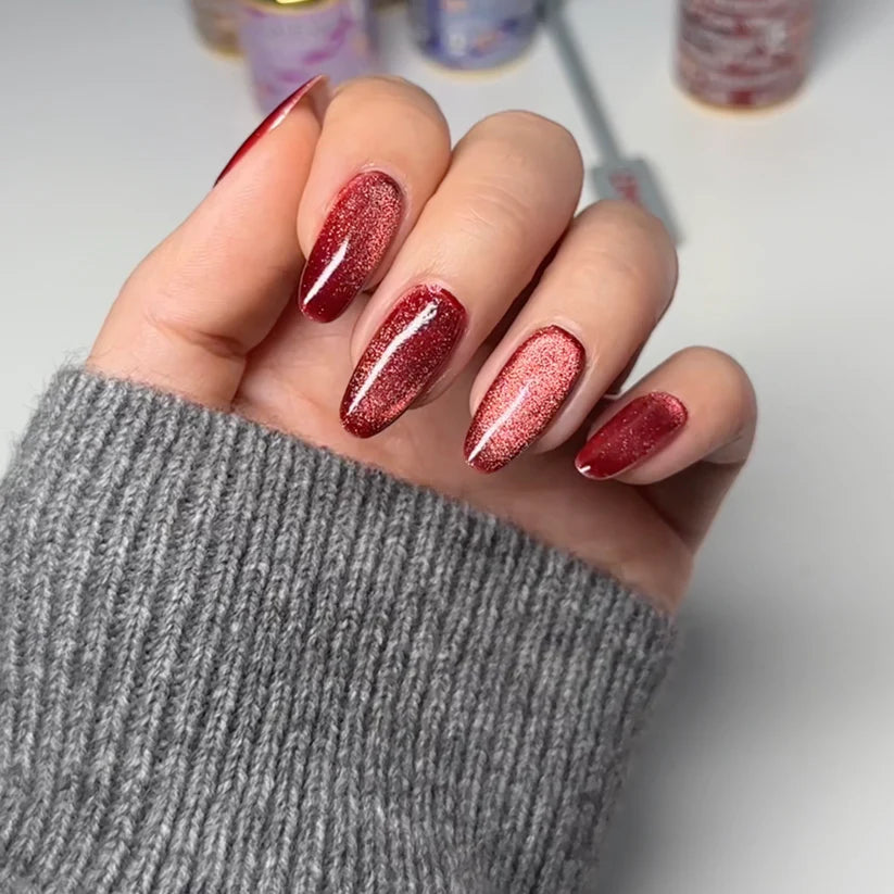 DND DC Gel Polish in Wine N' Lust #06, deep burgundy cat eye nail polish with shimmering finish, shown in a close-up image