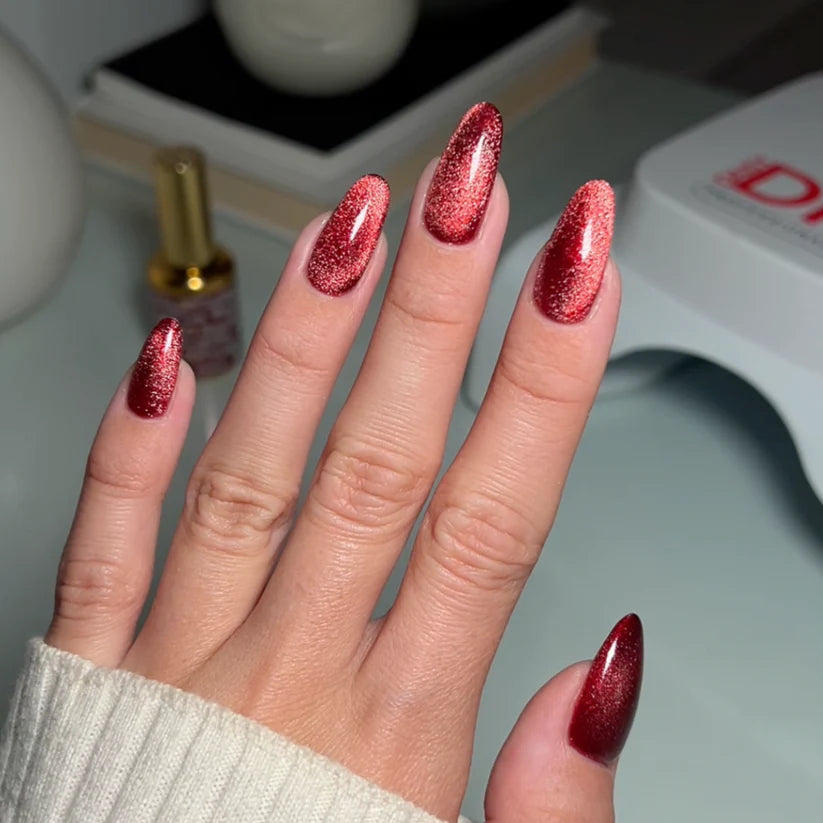 DND DC Gel Polish Cat Eye in Wine N' Lust #06 with smooth, glossy finish and vibrant wine color swatch.