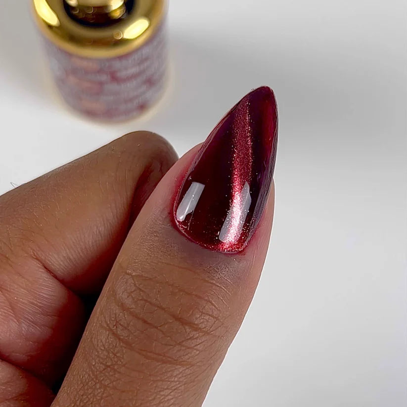 DND DC Gel Polish Cat Eye in Wine N' Lust shade, featuring a glossy wine-colored finish with a cat eye effect on nails.