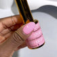 Swatch of DND DC GEL DUO Beautiful Disaster #271 gel nail polish and lacquer in vibrant pink with glitter accents.