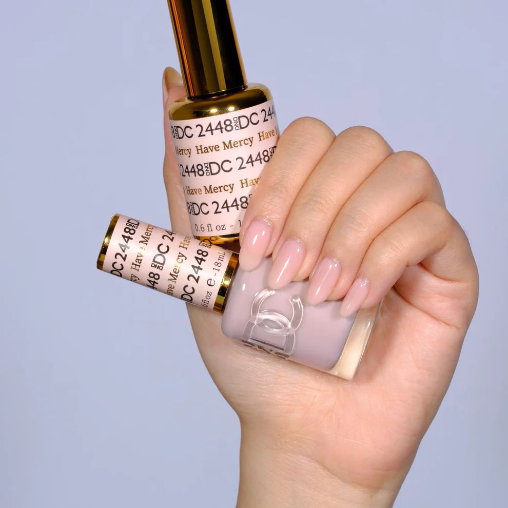 DND DC Gel Duo Have Mercy #2448 gel nail polish and lacquer set in a clear bottle with a black cap, showcasing vibrant color.
