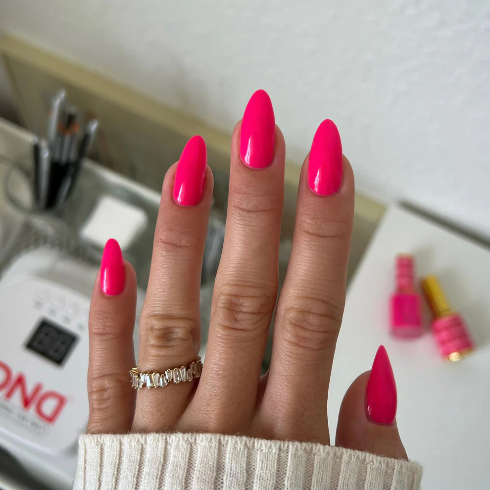 DND DC Gel Duo Hot Pink #157 gel nail polish and lacquer swatch showing vibrant pink color and glossy finish.