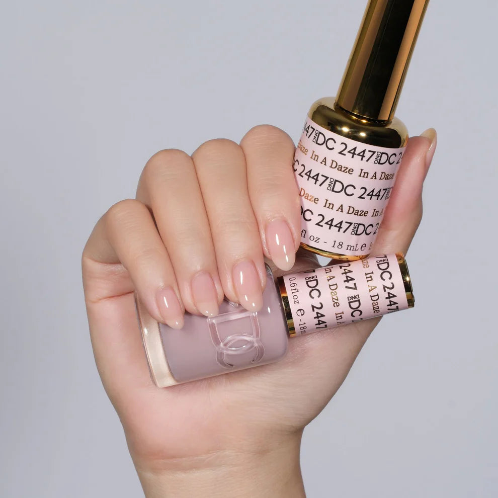 DND DC Gel Duo In A Daze #2447 gel nail polish and lacquer set with vibrant blue and purple shades, glossy finish, and sleek packaging