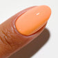 DND DC Gel Duo Mandarin Glow #2538 with vibrant orange gel nail polish and lacquer, glossy finish, in a clear bottle.