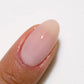 Swatch of DND DC Gel Duo Milky Pink #2461 gel nail polish and lacquer in a soft pink shade on a white background.