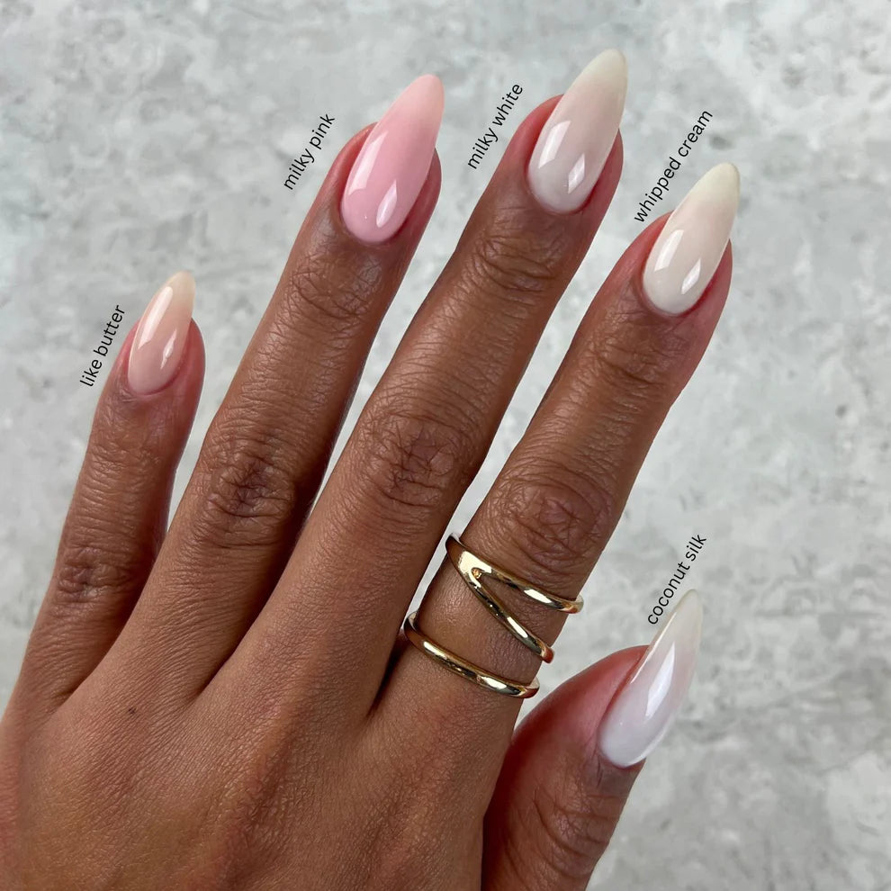 DND DC Gel Duo Milky White #2439 gel nail polish and lacquer set, featuring two bottles with white and clear gel finishes.