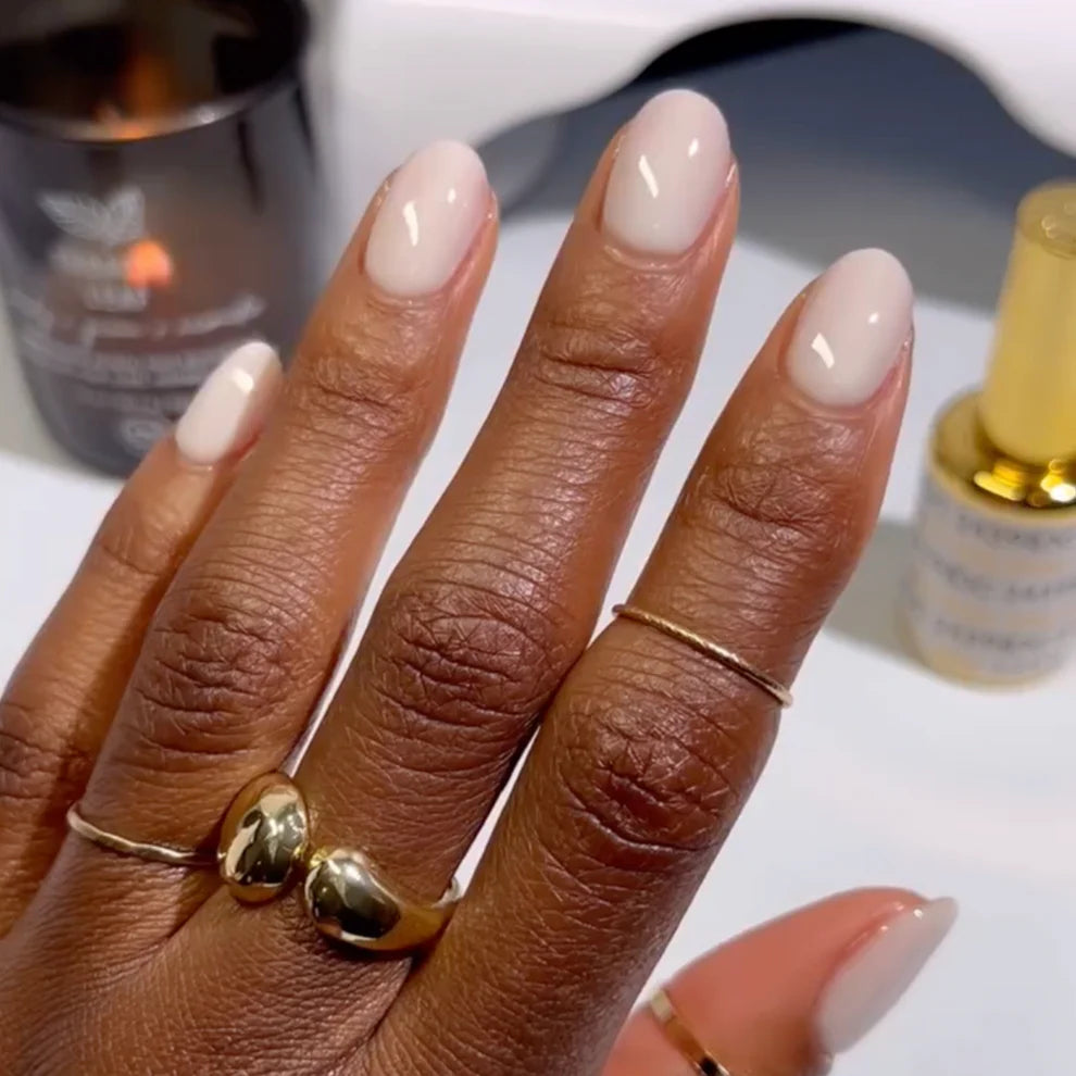 Swatch of DND DC Gel Duo in Milky White #2439 showing glossy gel nail polish and lacquer finish.