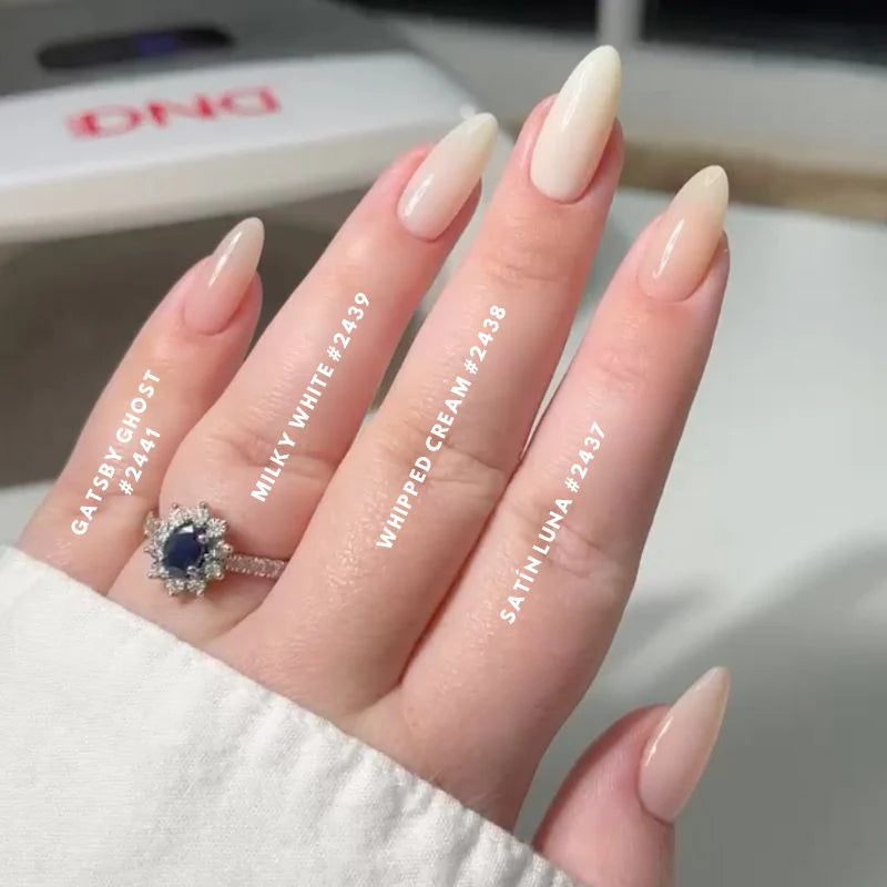 DND DC Gel Duo Milky White #2439 gel nail polish and lacquer set in a clear bottle with white cap and label