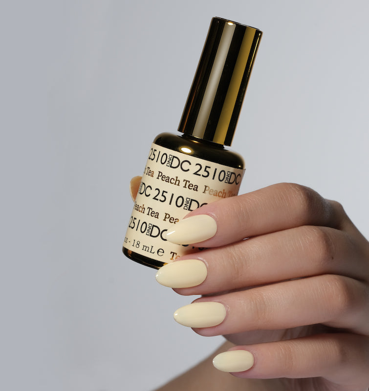 DND DC Gel Duo Peach Tea gel nail polish and lacquer set with peachy nude shade, glossy finish, and smooth application.