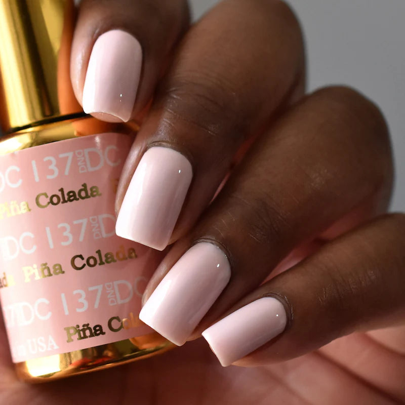 DND DC Gel Duo Pina Colada #137 with vibrant gel nail polish and lacquer showcasing a tropical pineapple-inspired color.