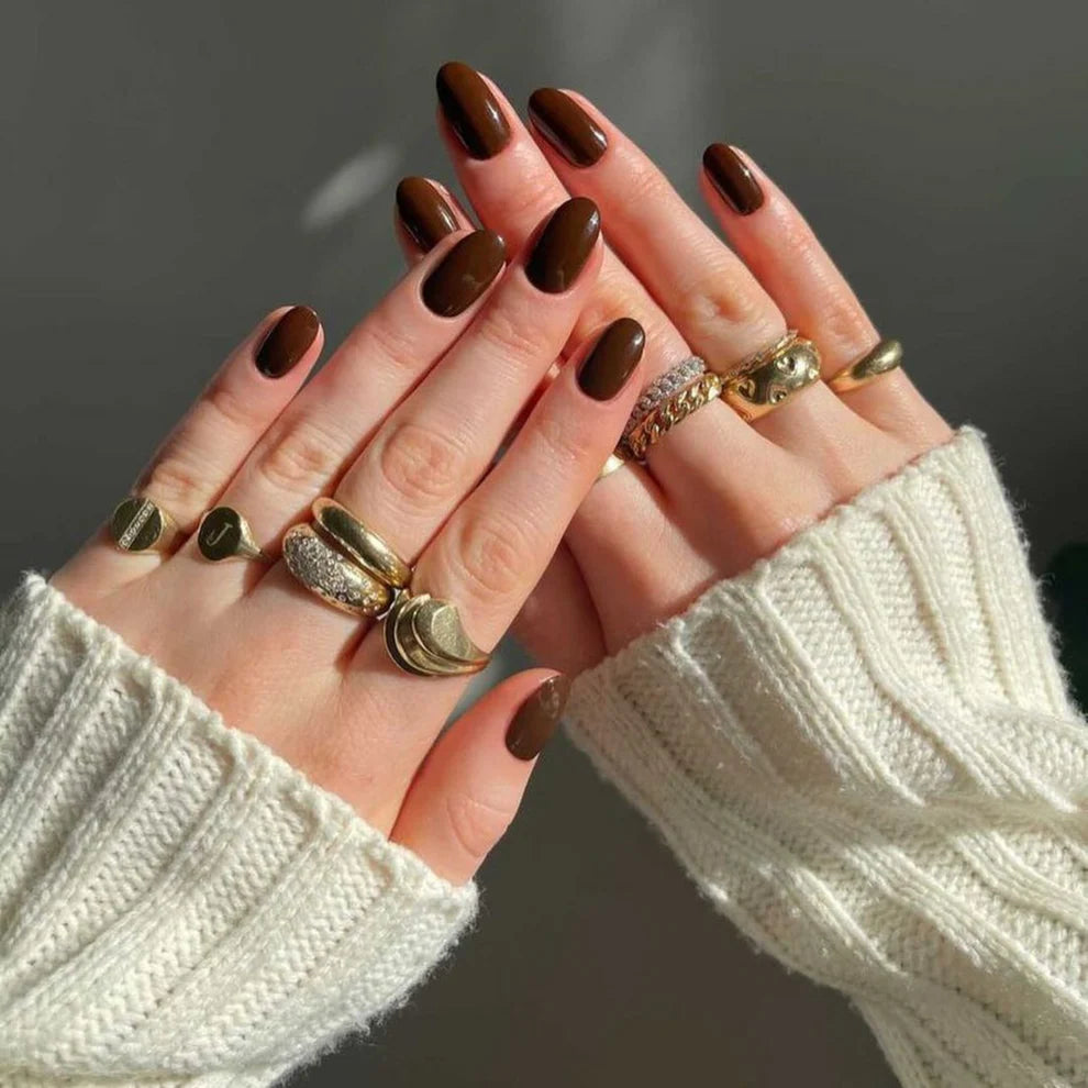 DND DC Gel Duo Spiced Brown #053 gel nail polish and lacquer set with glossy finish, shown on a nail tip.