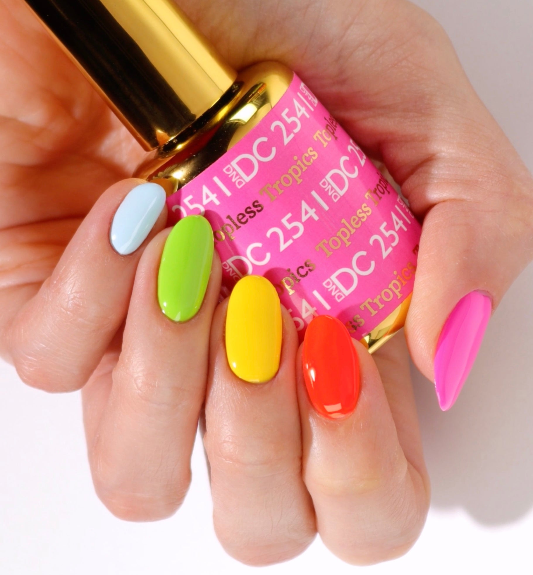 DND DC Gel Duo Topless Tropics #2541 with vibrant, rainbow-colored gel nail polish and lacquer swatches on a white background.