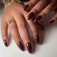 DND DC Gel Duo Walnut Brown #052 gel nail polish and lacquer swatch showing glossy finish on nails.