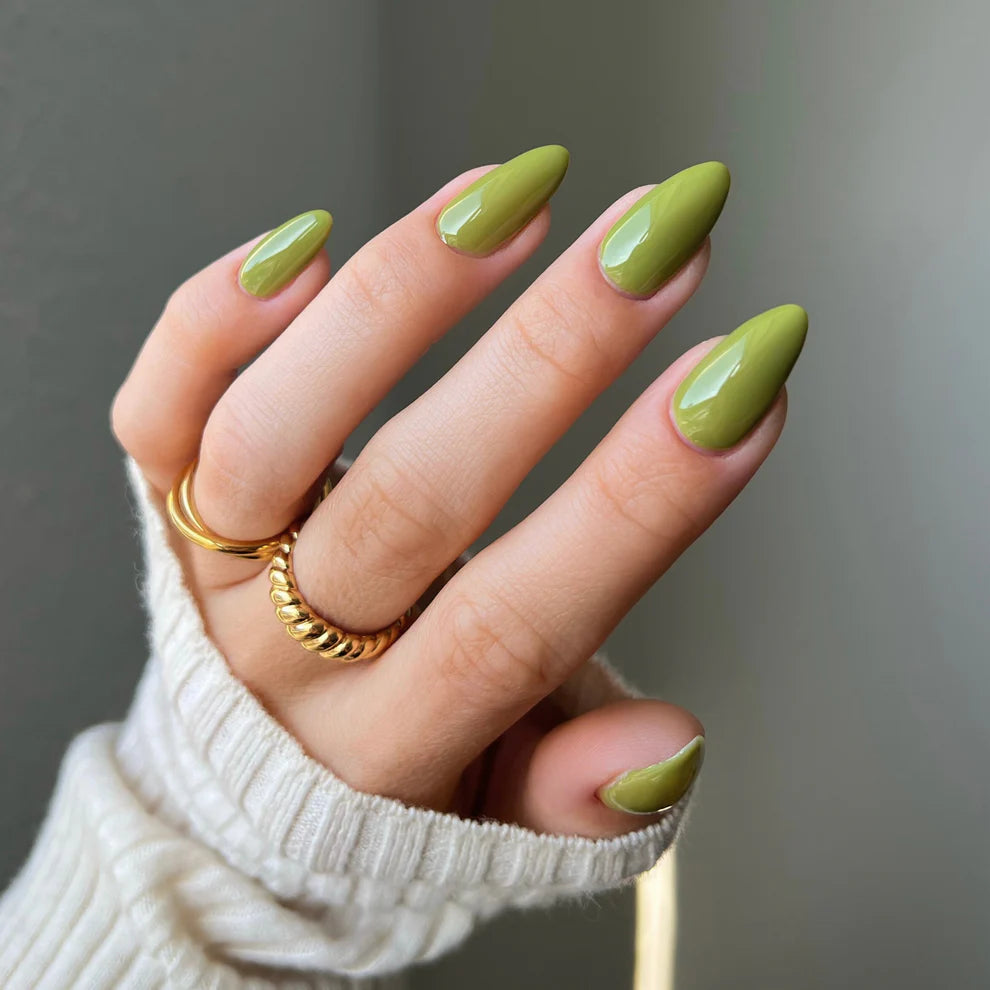 DND Diva Duo Gel & Polish in Collard Greens 281, featuring a vibrant green gel nail polish and lacquer on a hand model.