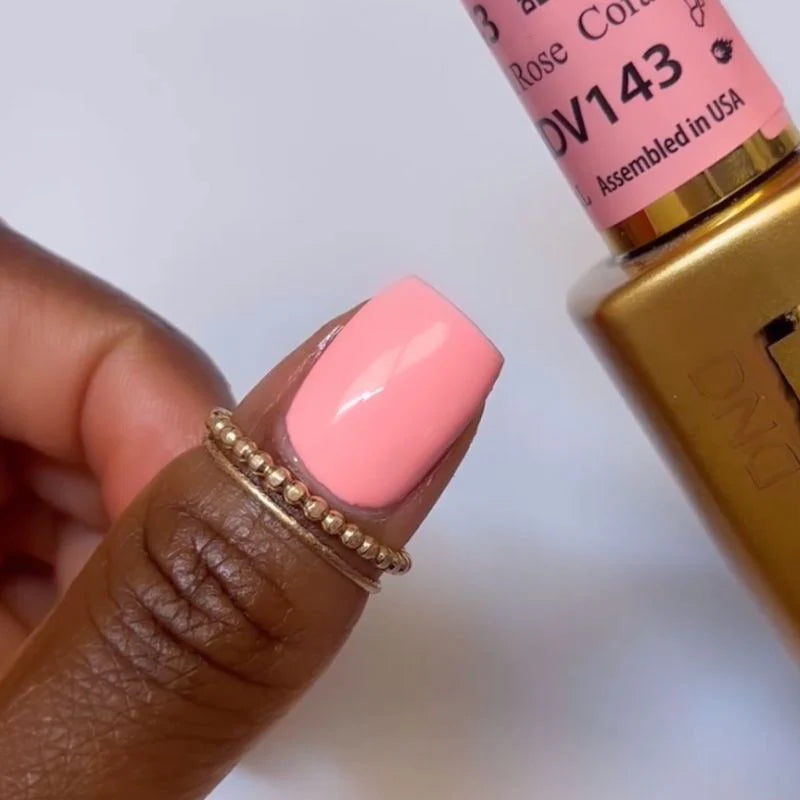 DND Diva Duo Gel & Polish in Coral Rose 143, showing vibrant coral pink gel nail polish and lacquer bottle side by side.