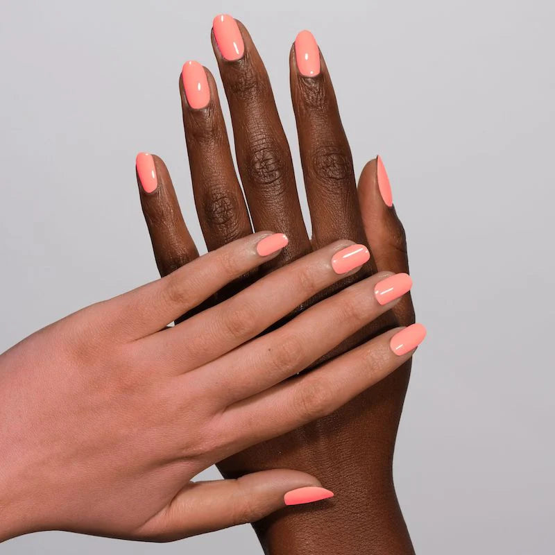DND Diva Duo Gel & Polish in Coral Rose 143, showing a vibrant coral pink gel nail polish and lacquer bottle.