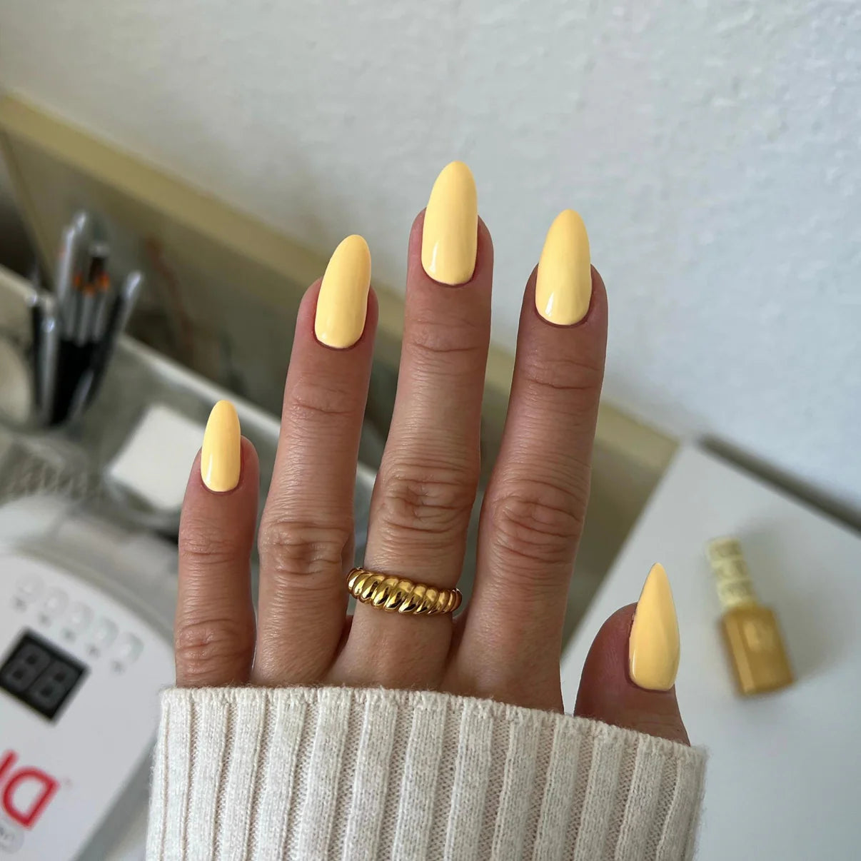 DND Diva Duo Gel & Polish Dandelion 084 swatch showing bright yellow gel nail polish and lacquer finish on nails