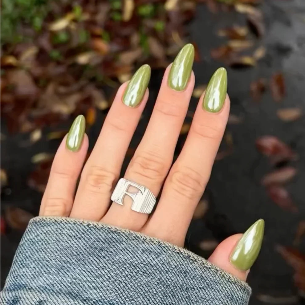 DND Diva Duo Gel & Polish in Dirty Martini 282, showing a close-up of the dark green gel and lacquer nail polish on nails