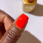 DND Diva Duo Gel & Polish in Fire Breather 217 showing vibrant orange-red gel nail polish and lacquer bottle.