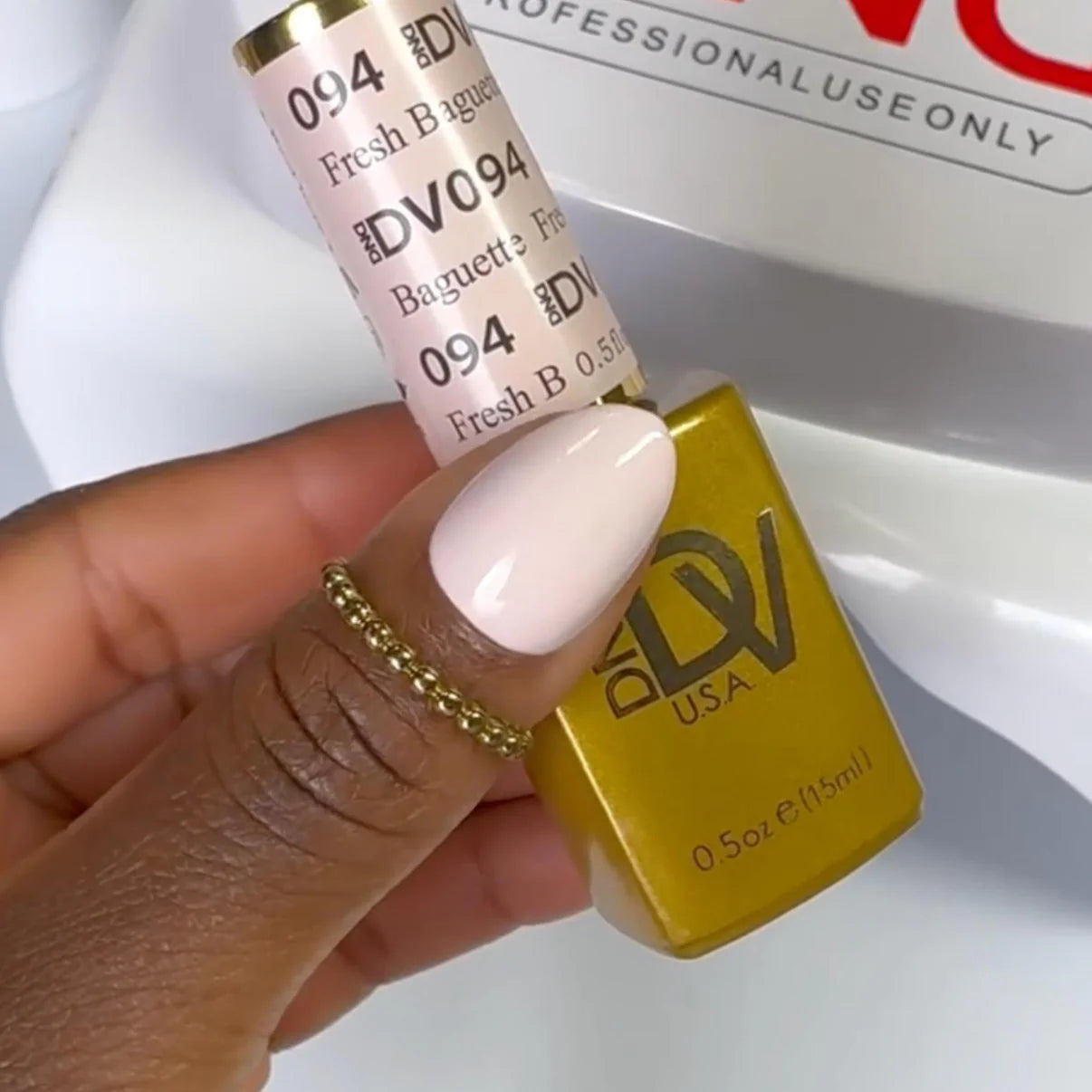 DND Diva Duo gel and polish in Fresh Baguette 094, showing a swatch of vibrant, warm-toned pink nail color.