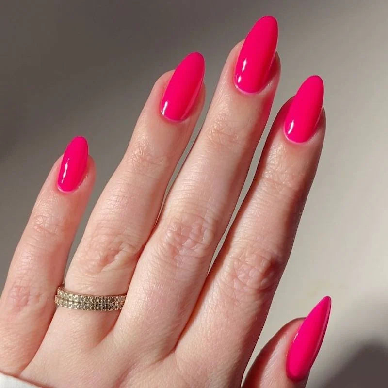 DND Diva Duo Gel and Polish in Juicy Cowgirl 229 showing vibrant pink gel nail polish and matching lacquer on nails