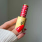 DND Diva Duo Gel & Polish Left Him On Red 163, bright red gel nail polish in a bottle with a black cap and clear label.