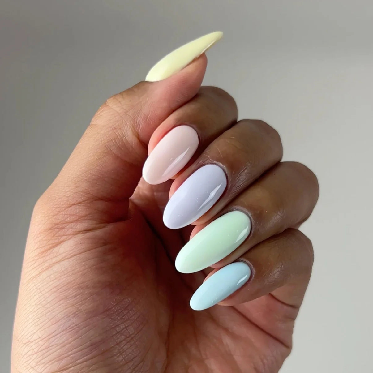 DND Diva Duo Gel and Polish in Paint Me Like A French Girl with multiple gel and lacquer bottles on a nail art display.