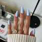 DND Diva Duo Gel & Polish Pies In The Sky 129 set with vibrant blue gel nail polish and matching lacquer, shown on a hand.