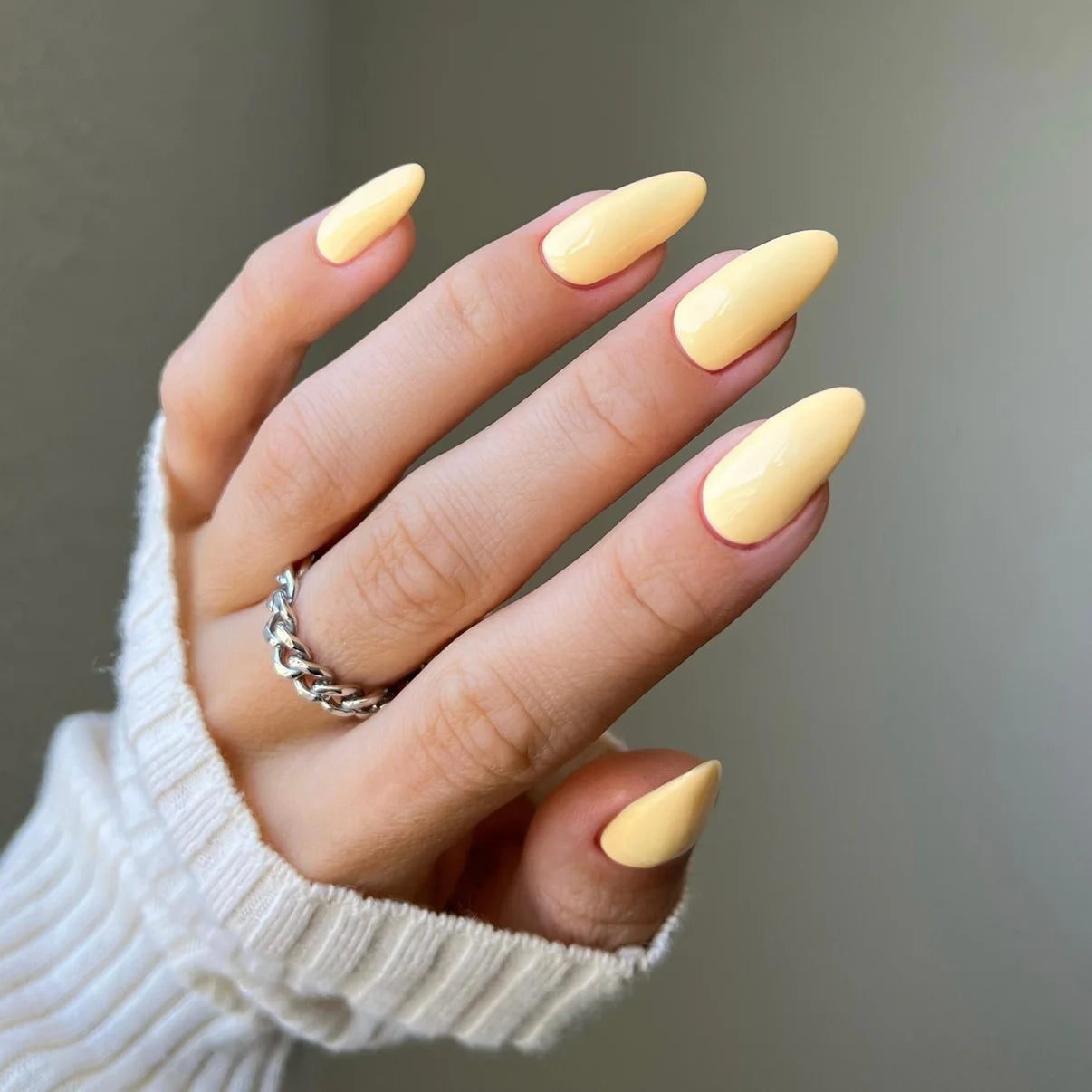 DND Diva Duo Gel & Polish in Plz Durian 086, showing swatch of vibrant green gel nail polish and lacquer on a nail.