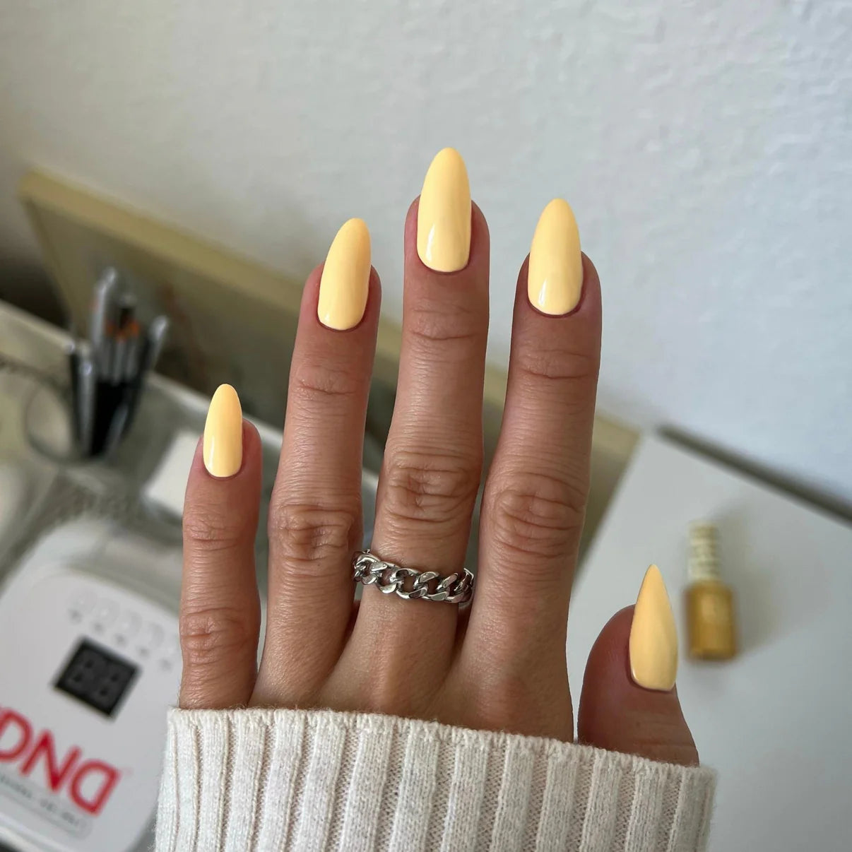 DND Diva Duo Gel & Polish Plz Durian 086 swatch showing vibrant durian yellow gel nail polish and lacquer on nails