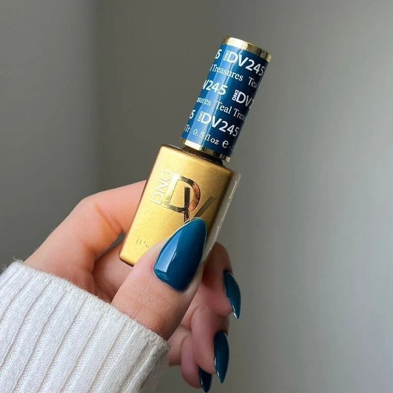 DND Diva Duo Gel & Polish in Teal Treasures 245 showing a vibrant teal gel nail polish and lacquer bottles with a glossy finish.