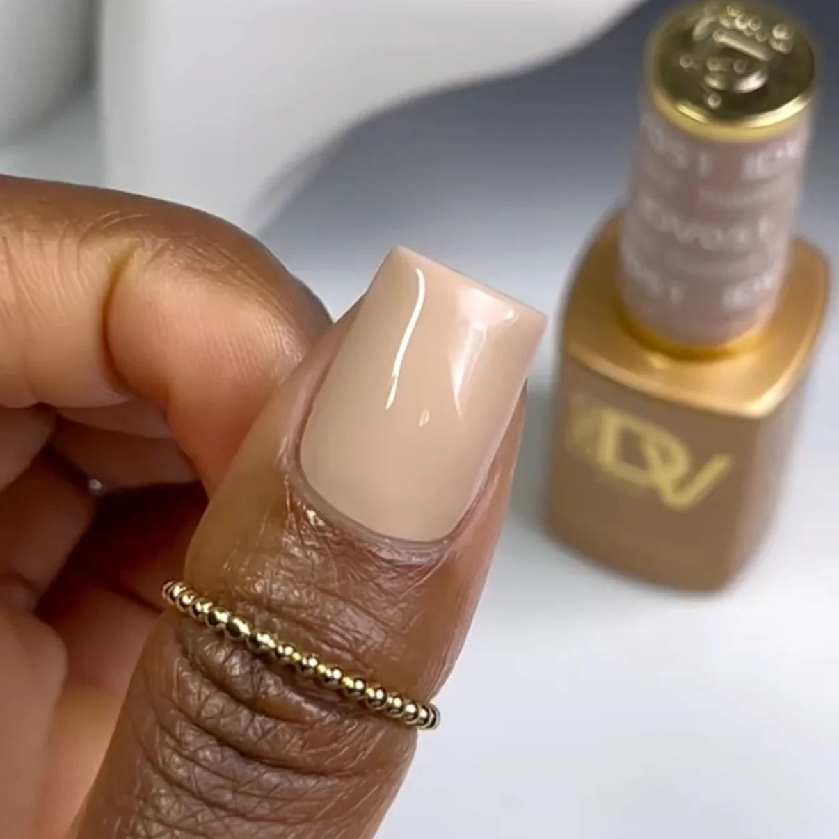 DND Diva Duo Gel & Polish Toasted 051 swatch showing a warm nude gel nail polish and lacquer finish.